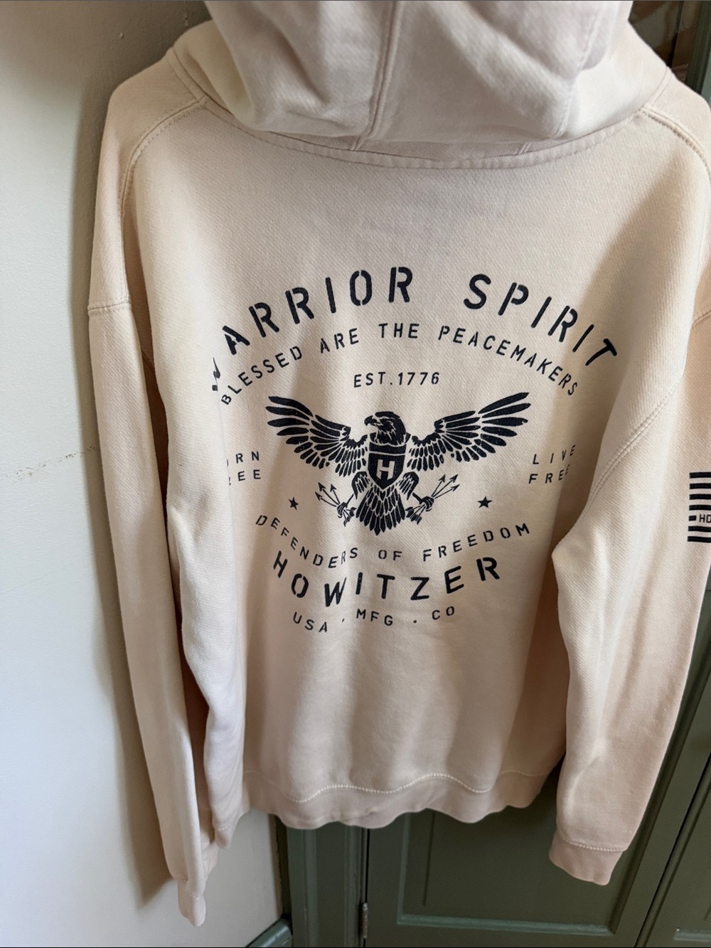 Warrior Spirit Cream Pullover Hoodie with Subtle Chest Graphic
